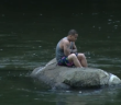 Firefighters rescue swimmer stranded on rock