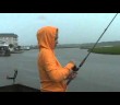 Girl almost catches really big fish