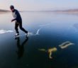 Freediver Petr Kapoun Swims Under Crystal-Clear Frozen Surface of Lake Milada