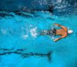 person swimming on body of water