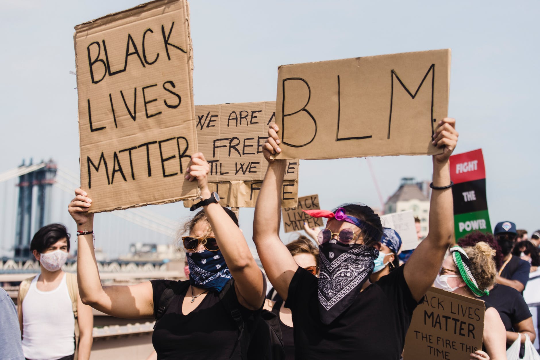 people protesting and holding signs